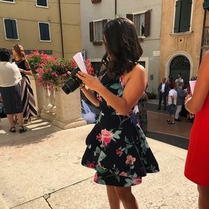 Navy blue cocktail dress with floral print.